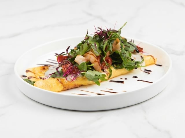 Omelette with stracciatella and shrimp salad