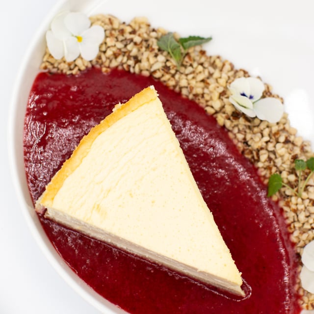 Keto cheesecake with granola in strawberry lake